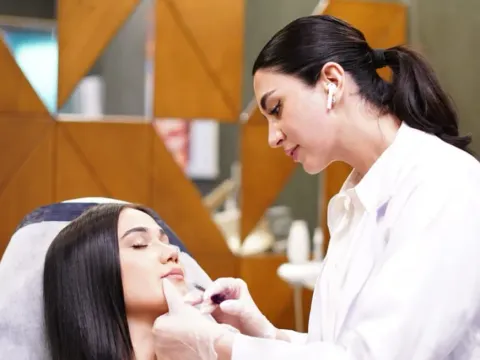 Doctor treating a patient at Estheticare Clinic